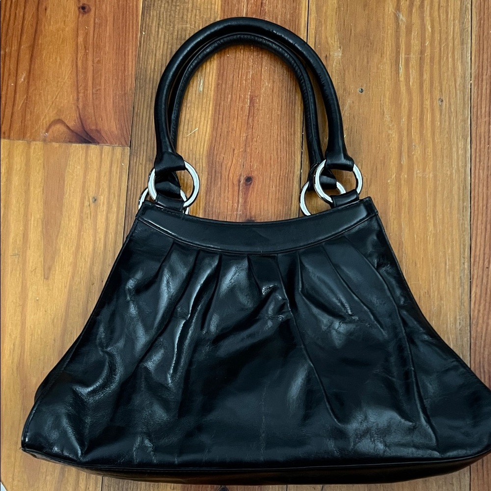 Black smooth leather handbag by Hobo
